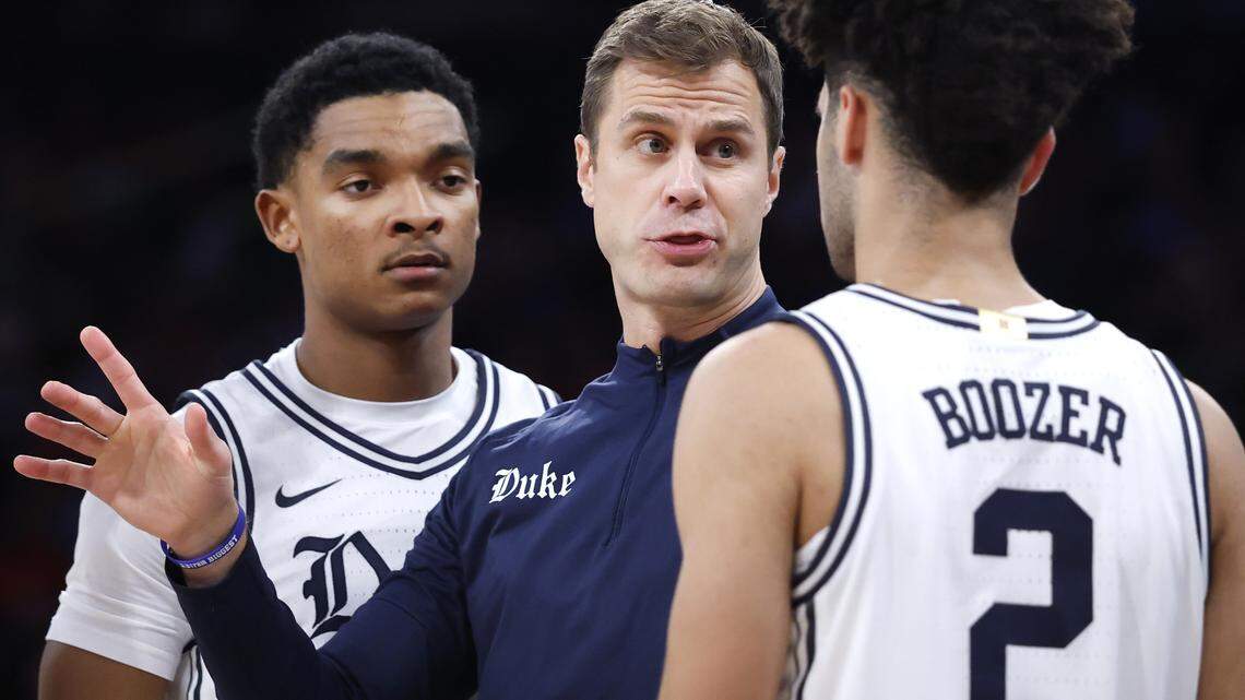 Duke head coach Jon Scheyer talks to Isaiah Evans (3), Caleb Foster (1) and Cayden Boozer (2) during Texas Tech’s 82-81 victory in the SentinelOne Classic at Madison Square Garden in New York City, N.Y., Saturday, Dec. 20, 2025.
