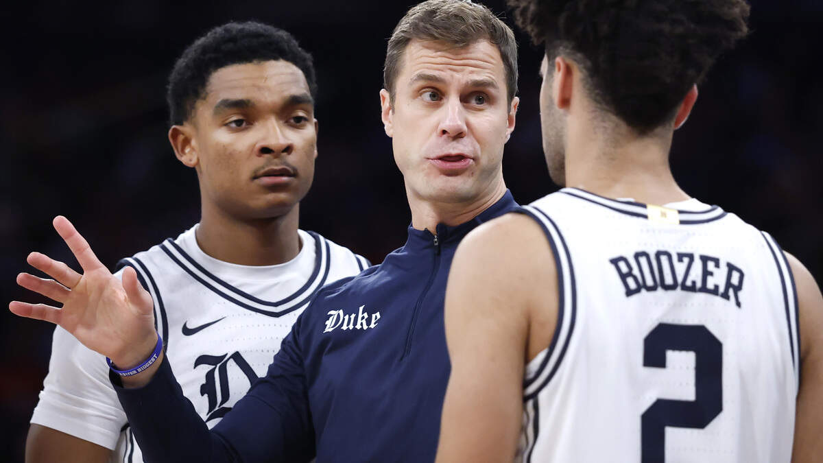 Duke head coach Jon Scheyer talks to Isaiah Evans (3), Caleb Foster (1) and Cayden Boozer (2) during Texas Tech’s 82-81 victory in the SentinelOne Classic at Madison Square Garden in New York City, N.Y., Saturday, Dec. 20, 2025.