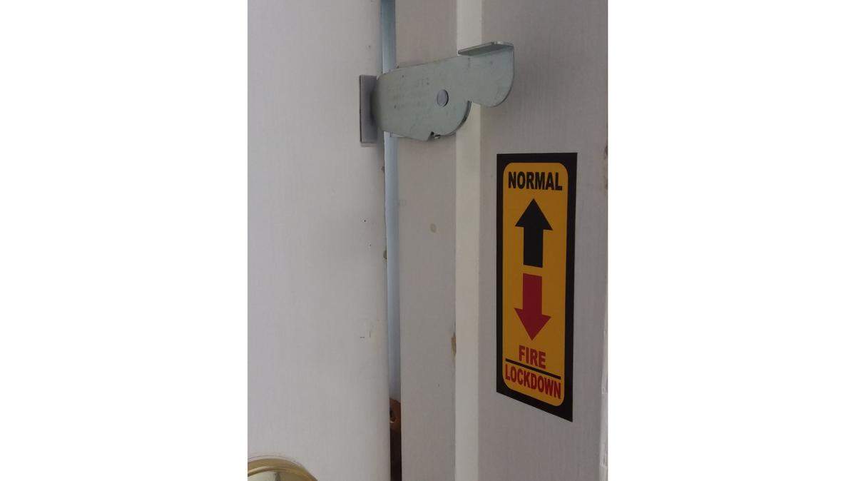 The School Safe device keeps a locked door slightly ajar. In an emergency, the door can be quickly closed.