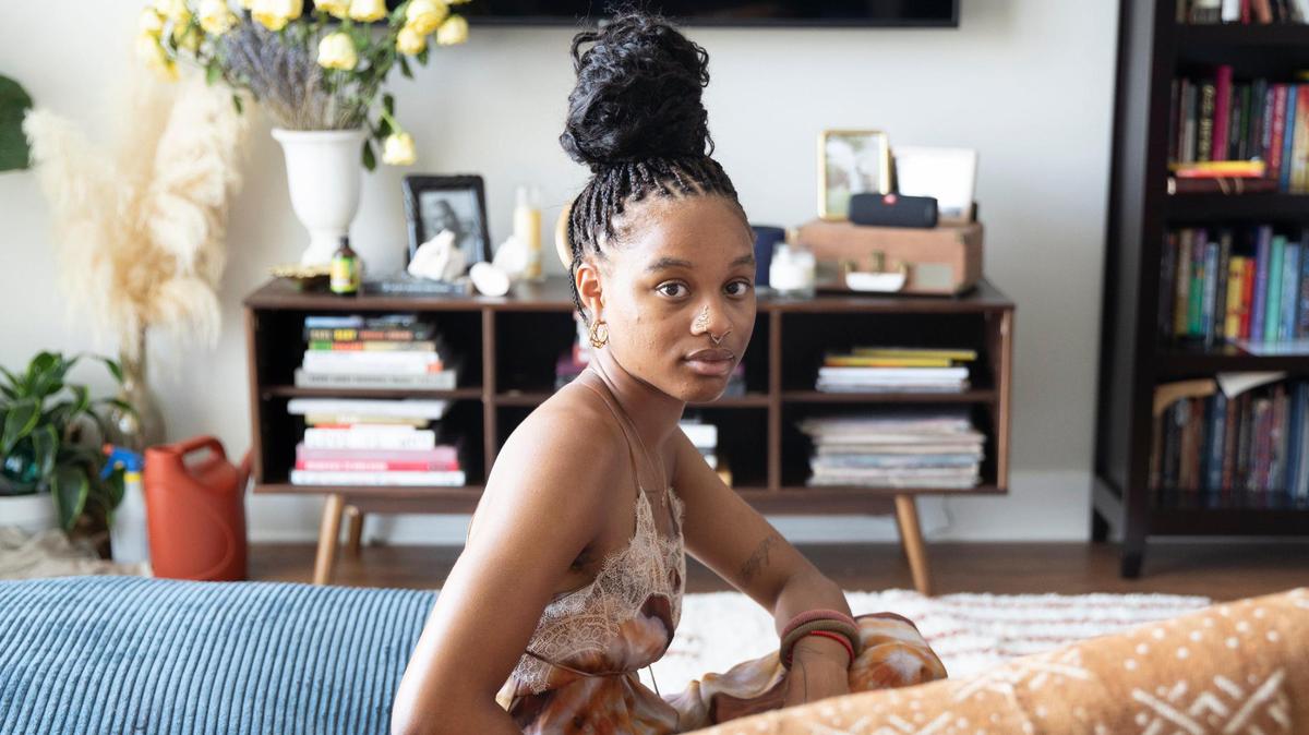 Kennedi Carter, 22, poses for a portrait in her apartment in Durham, N.C., on July 7, 2021. The Durham native was 21 when she became the youngest photographer to shoot a cover for British Vogue.