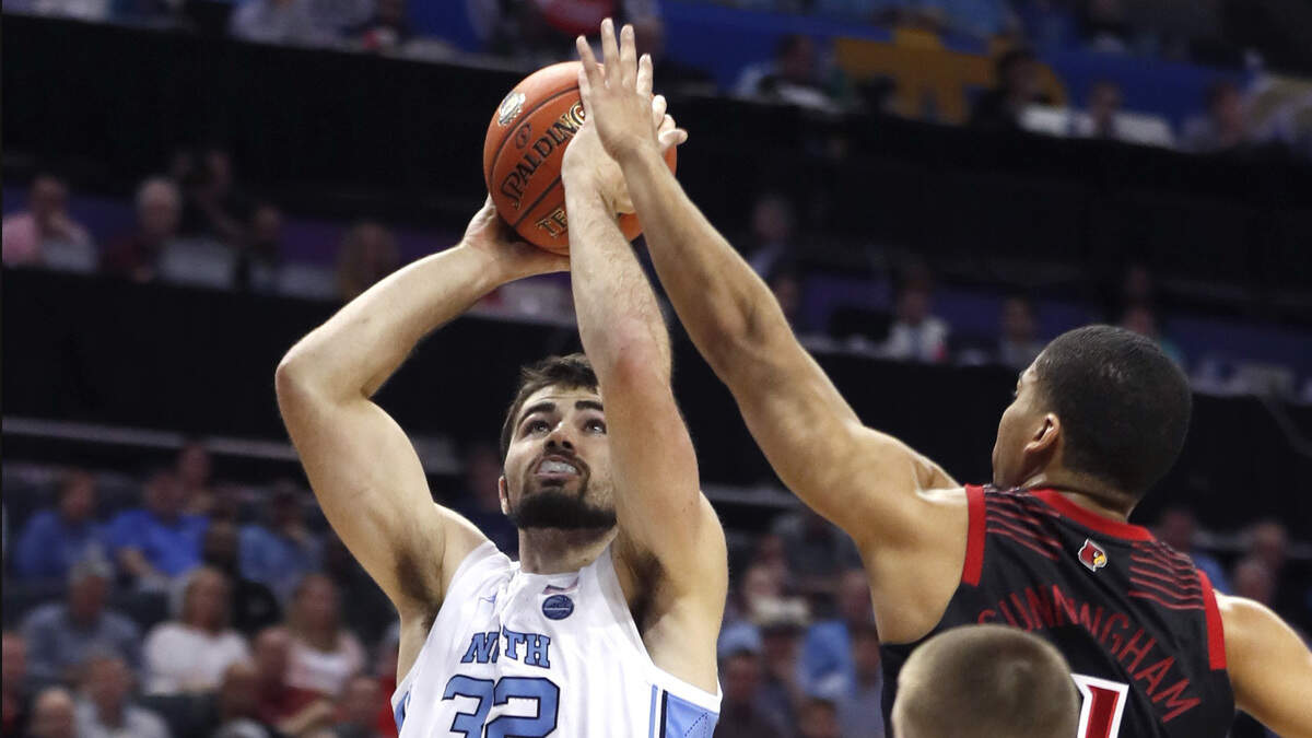 North Carolina’s Luke Maye (32) shoots while Louisville’s Christen Cunningham (1) defends during the first half of UNC’s game against Louisville in the quarterfinals of the 2019 ACC Tournament in Charlotte, N.C., Thursday, March 14, 2019.