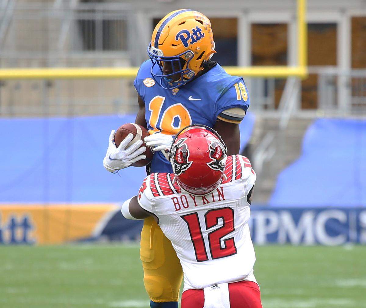 Pittsburgh Panthers wide receiver wide receiver Shocky Jacques-Louis (18) makes a catch as N.C. State’s Devan Boykin (12) defends during their game at Heinz Field Saturday, Oct. 3, 2020.