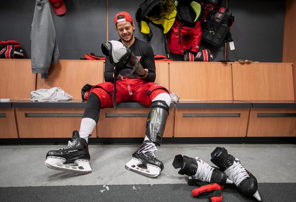 The Carolina Hurricanes Jesperi Kotkaniemi (82) removes his equipment following the morning skate ahead of Game 3 of the Eastern Conference Finals against the Florida Panthers on Monday, May 22, 2023 at FLA Live Arena in Sunrise, Fla.