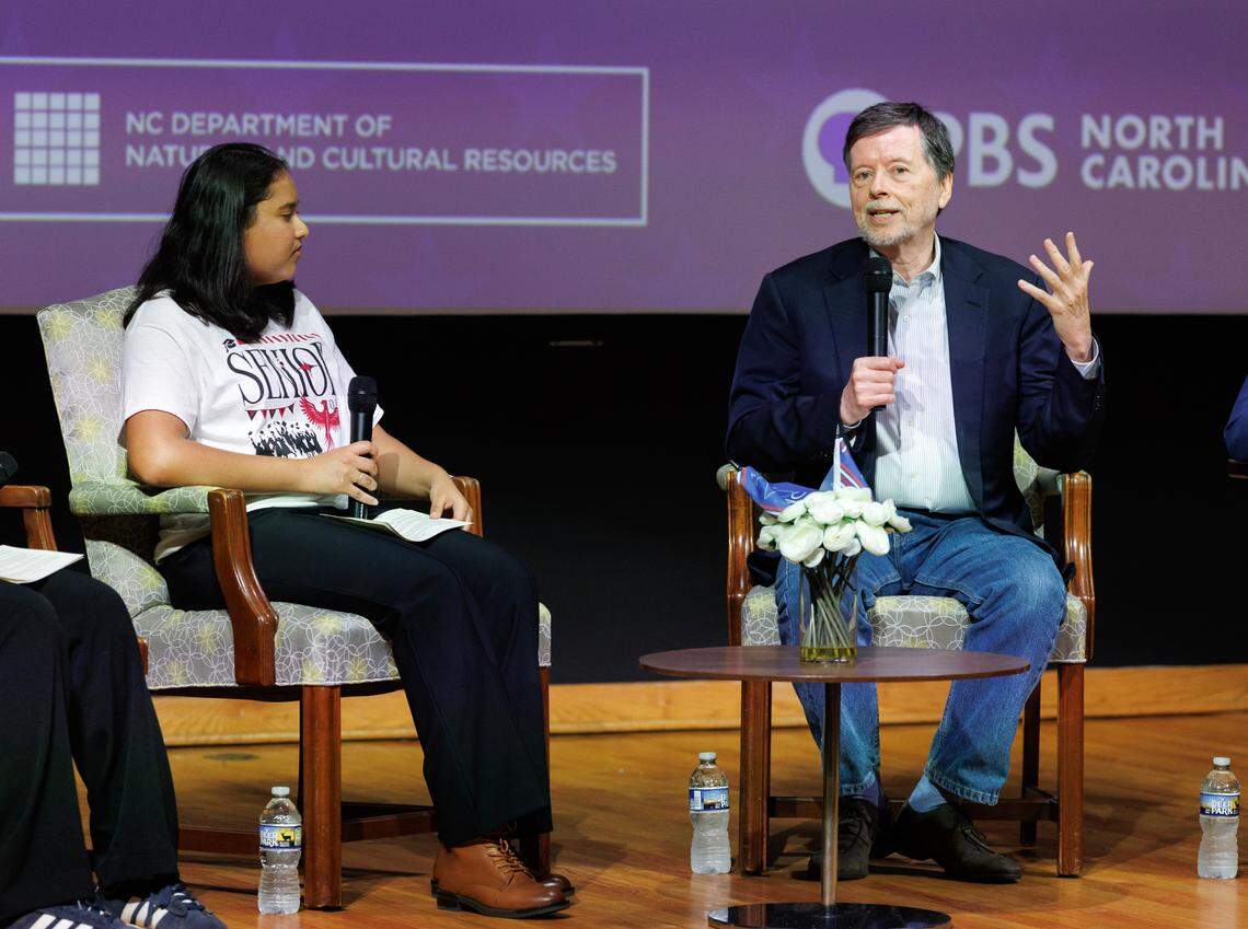 Nishitha Daniels, a senior at Early College of Guilford, listens as filmmaker Ken Burns speaks during a panel discussion on Thursday, May 15, 2025, in Raleigh, N.C.