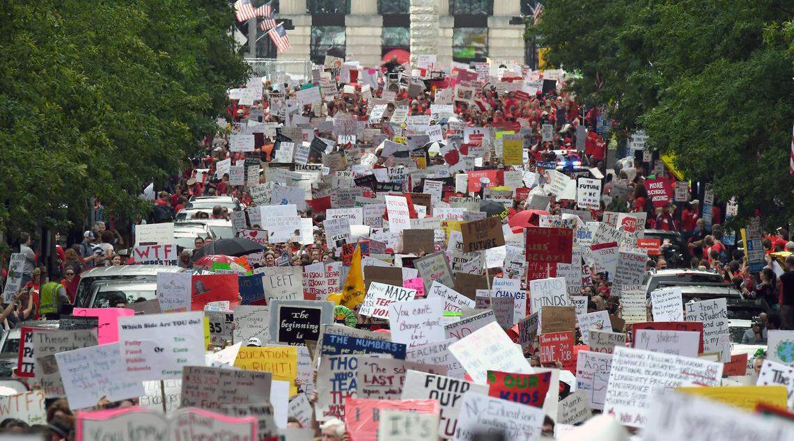 Thousands of teachers crowd Fayetteville Street in Raleigh, N.C. Wednesday, May 16, 2018 as they march to the N.C. Legislative building during the  “March for Students and Rally for Respect.” NCAE is organizing another march on May 1, 2026.