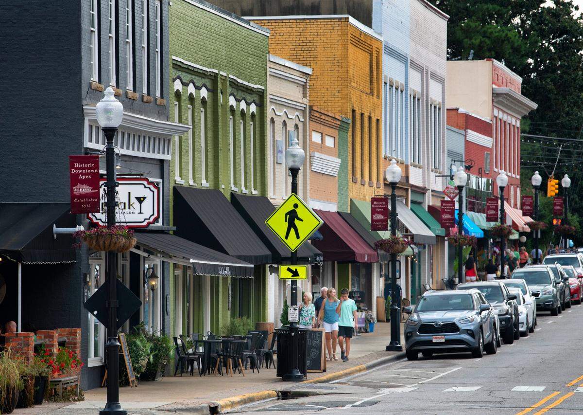 People walk around downtown Apex in August. The 13th district represents some fast-growing towns in southwestern Wake County, including Apex.