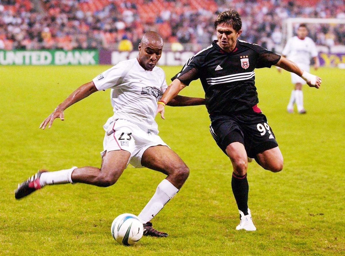 Jaime Moreno, right, of D.C. United battles for the ball against Eddie Pope of the MetroStars during the first half in the MLS Eastern Conference semifinals on Oct. 30, 2004 at RFK Stadium in Washington.