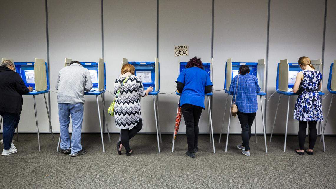 A line of voters cast their ballots in the 2018 midterm elections at the Ivy Community Center at 7am on Tuesday, Nov. 6, 2018, in Durham, NC.
