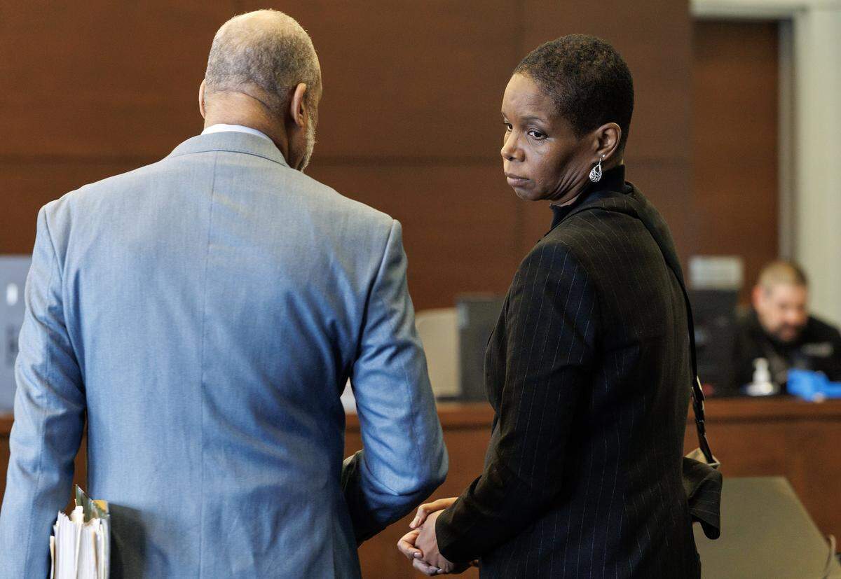 Ayesha Hunter, right, a Durham Public Schools official charged with obstruction of justice and perjury, makes a first appearance at the Durham County Courthouse on Thursday, Feb. 5, 2026. 
