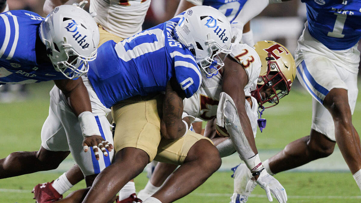 Duke’s Chandler Rivers brings down Elon’s Rushawn Baker during the first half of the Blue Devils’ season opener against Elon on Friday, Aug. 30, 2024, at Wallace Wade Stadium in Durham, N.C.