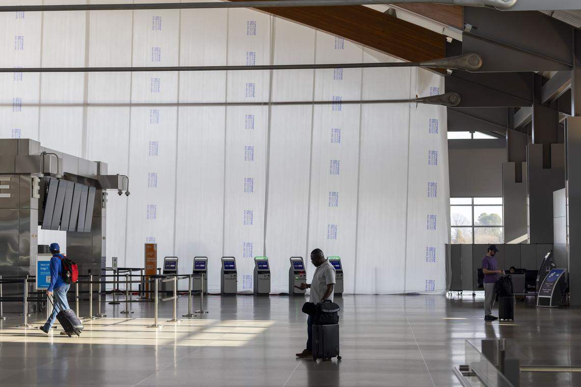 A large wall of plastic covers the north side widows of RDU International Airport’s Terminal 2 on Friday, January 9, 2026. This is the most visible step in the expansion of the building to add new ticketing counters, baggage carousels and room for customs. 