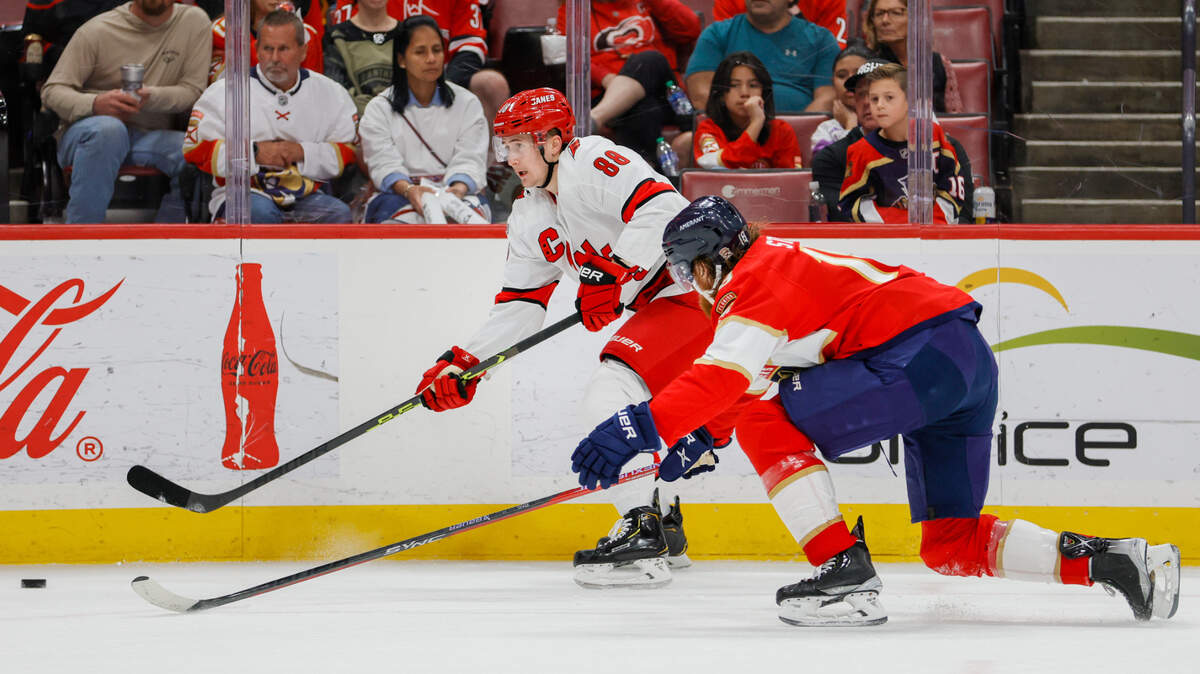 Carolina Hurricanes center Martin Necas (88) moves the puck against Florida Panthers defenseman Marc Staal (18) during the first period at FLA Live Arena.