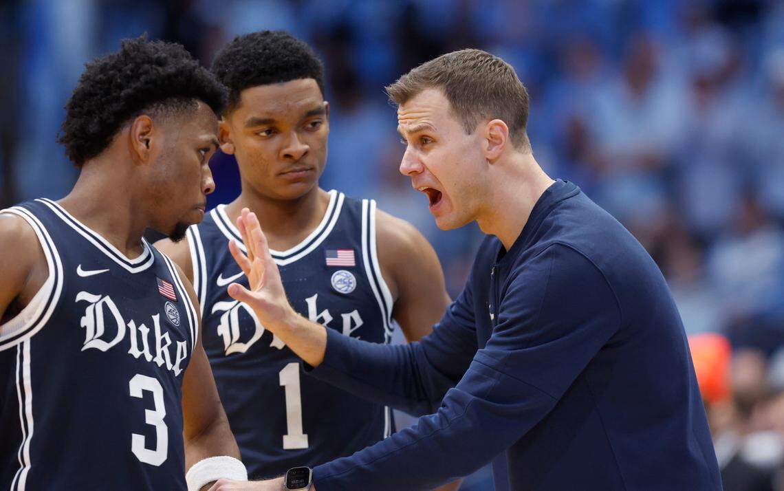 Duke’s head coach Jon Scheyer talks with Jeremy Roach (3) and Caleb Foster (1) during the second half of UNC’s 93-84 victory over Duke at the Smith Center in Chapel Hill, N.C., Saturday, Feb. 3, 2024.