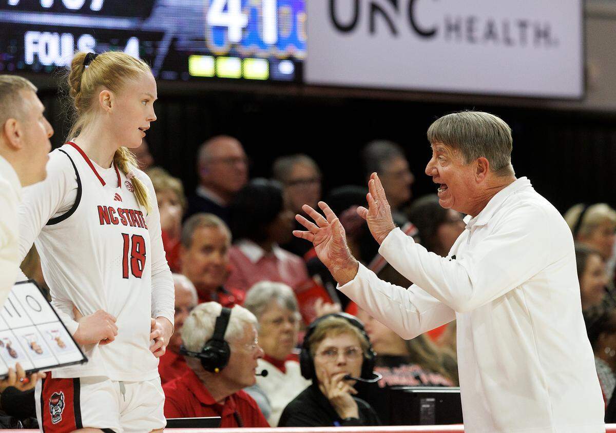 N.C. State head coach Wes Moore speaks with Tilda Trygger during the second half of the Wolfpack’s 83-67 win over Pittsburgh on Thursday, Jan. 16, 2025, at Reynolds Coliseum in Raleigh, N.C.