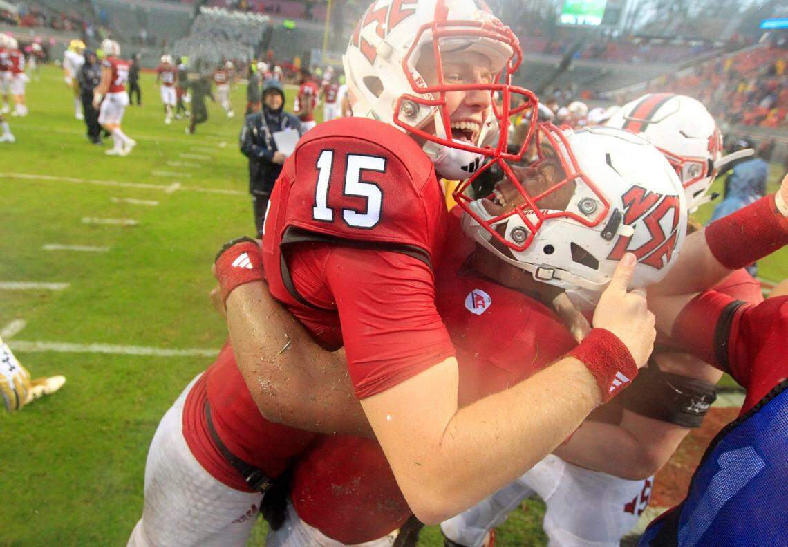 N.C. State quarterback Ryan Finley (15), left, celebrates with quarterback Jalan McClendon (2) after N.C. State’s 10-3 victory over Notre Dame at Carter-Finley Stadium in Raleigh, N.C., Saturday, Oct. 8, 2016.