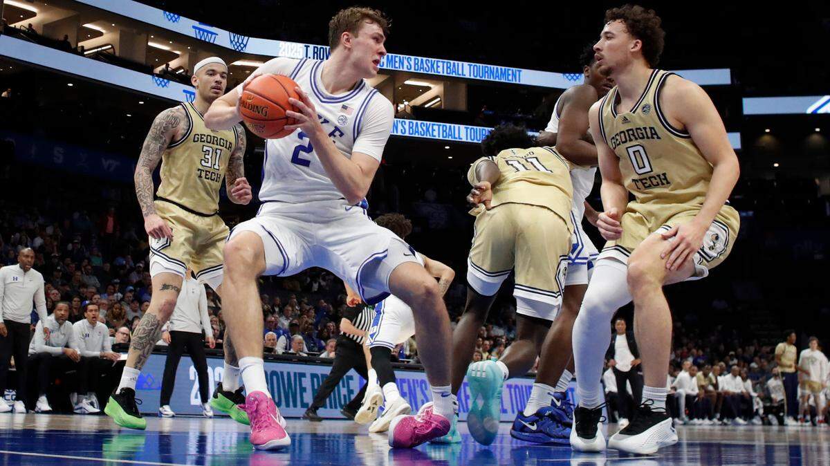 Duke’s Cooper Flagg rolls his left ankle after coming down with a rebound during the first half of Duke’s game against Georgia Tech in the quarterfinals of the 2025 ACC Men’s Basketball Tournament at the Spectrum Center in Charlotte, N.C., Thursday, March 13, 2025. Flagg, who left the game, returned to the bench for the second half.