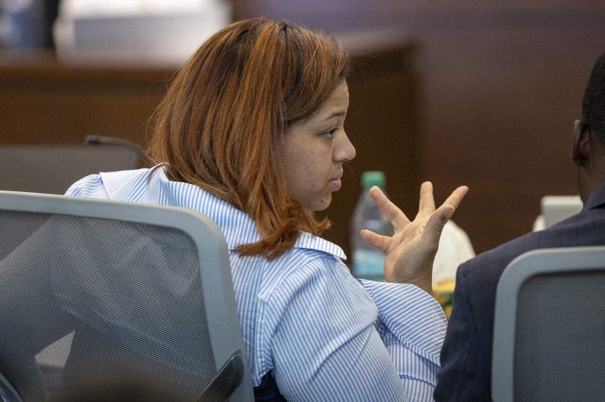 Plaintiff Akira Montague speaks with her counsel during an alienation of affection trial in Durham County Superior Court on Thursday, Nov. 6, 2025. Montague sued TikTok personality Brenay Kennard in May 2024, accusing her of having an affair with Montague’s now ex-husband, Timothy Montague, according to the complaint. Montague is seeking more than $3.5 million in damages.