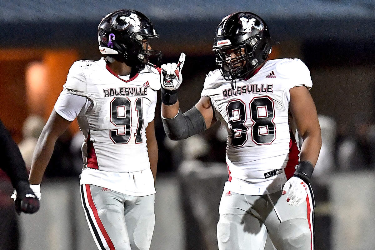 Rolesville’s Cameron Harrison (88) reacts after his sack of Cleveland quarterback Jackson Byrd with Jayden Fry (91) late in the first half. The Rolesville Rams and the Cleveland Rams met in the fourth round of the NCHSAA 4A football playoffs in Clayton, N.C. on December 6, 2024.