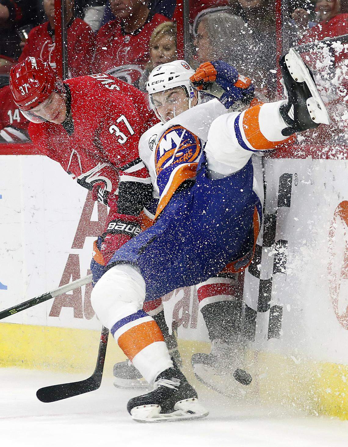 Carolina Hurricanes’ Andrei Svechnikov (37) collides with New York Islanders’ Adam Pelech (3), of Russia, during the second period of an NHL hockey game, Sunday, Oct. 28, 2018, in Raleigh, N.C. (AP Photo/Karl B DeBlaker)