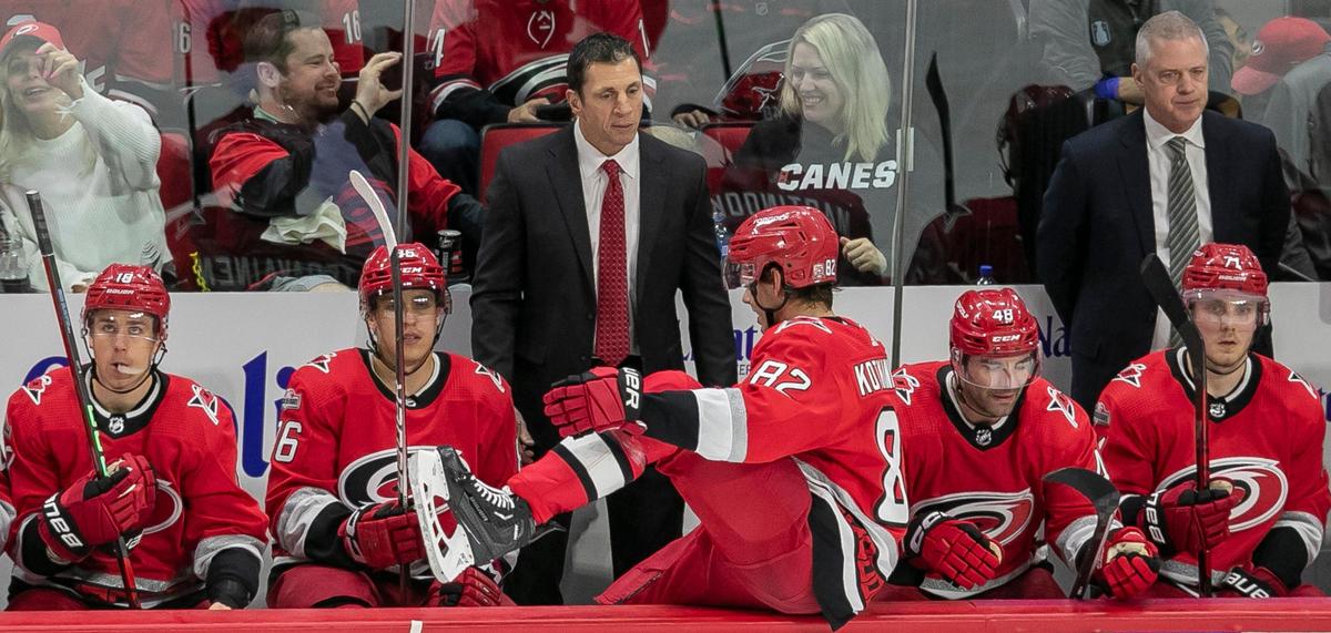 Carolina Hurricanes’ coach Rod Brind’Amour talks with Jesperi Kotkaniemi (82) during a time out in the second period against the New York Islanders on Monday, April 17, 2023 at PNC Arena in Raleigh, N.C.