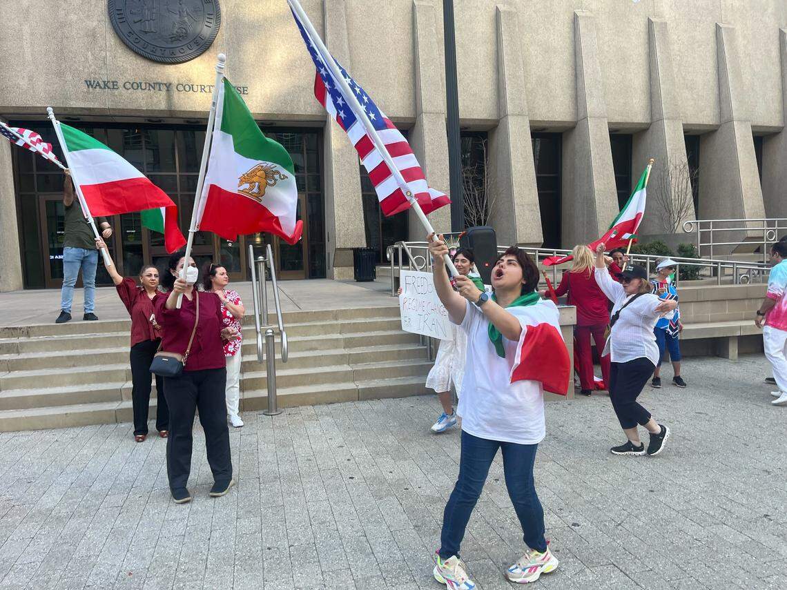 A group of Iranians gather at the Wake County Courthouse to celebrate the death of Ayatollah Ali Khameini and thank the U.S. for military action.