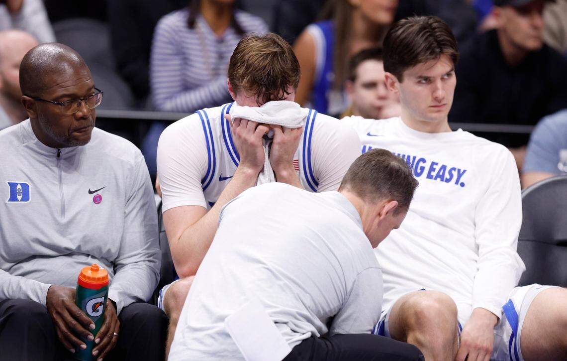 Duke’s Cooper Flagg (2) is checked on while on the bench after being injured during the first half of Duke’s game against Georgia Tech in the quarterfinals of the 2025 ACC Men’s Basketball Tournament at the Spectrum Center in Charlotte, N.C., Thursday, March 13, 2025.