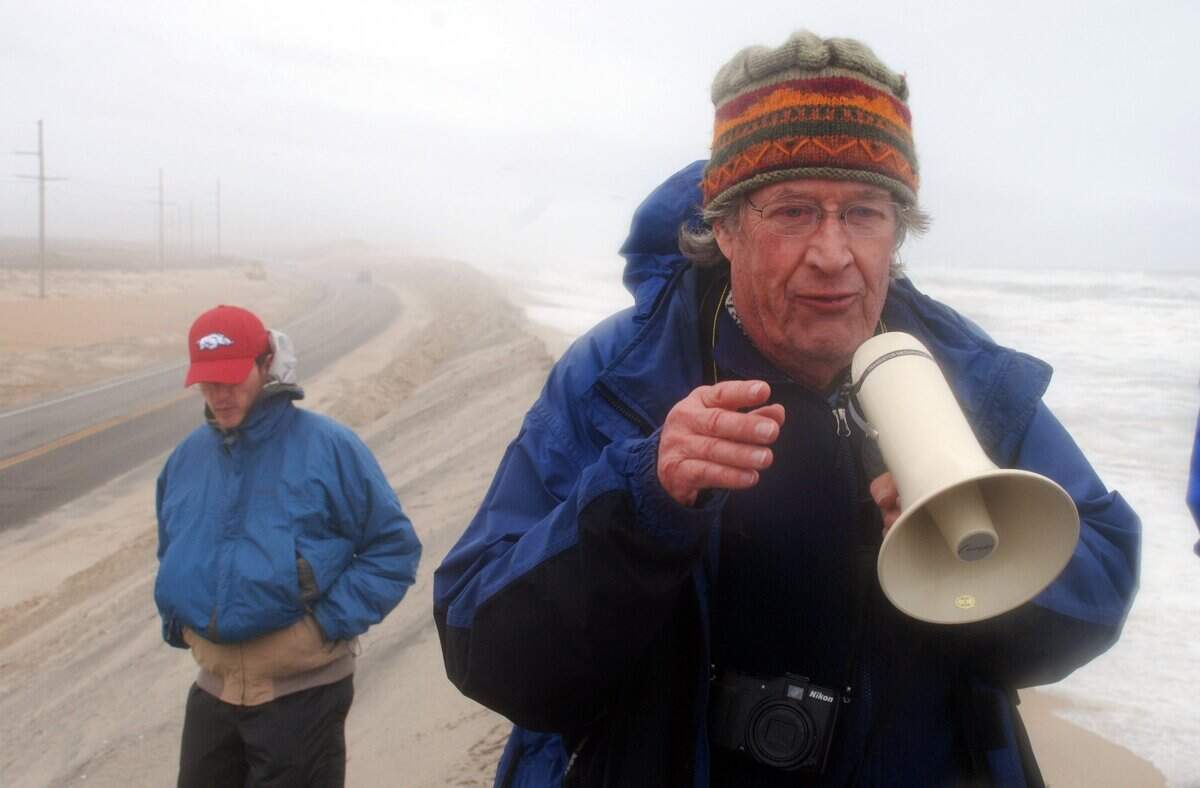 Stan Riggs, photographed in 2014, is a renowned geologist and marine scientist. He’s the author of the book “The Battle for North Carolina’s Coast.” He’s pictured here on a dune built to protect N.C. 12.