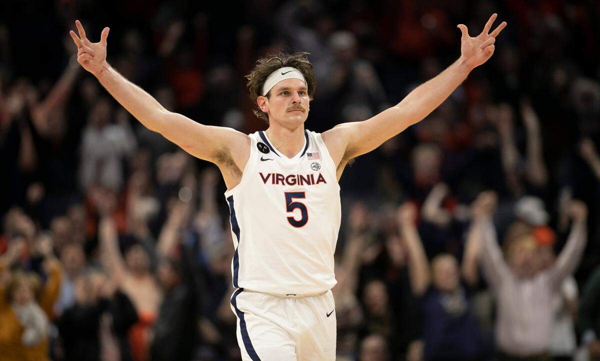 Virginia’s Ben Vander Plas (5) reacts after sinking a three point basket to give the Cavaliers a 42-40 lead in the second half. North Carolina would never regain the lead, falling 65-58 on Tuesday, January 10, 2023 at John Paul Jones Arena in Charlottesville, Va.