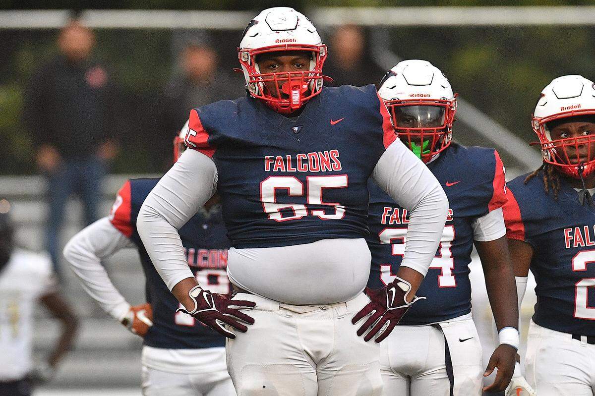 jordan’s Noah Clark (65) looks to the sidelines between plays against Smithfield-Selma during the first half. The Durham Jordan Falcons and the Smithfield-Selma Spartans met in a football game in Durham, N.C. on September 13, 2024.