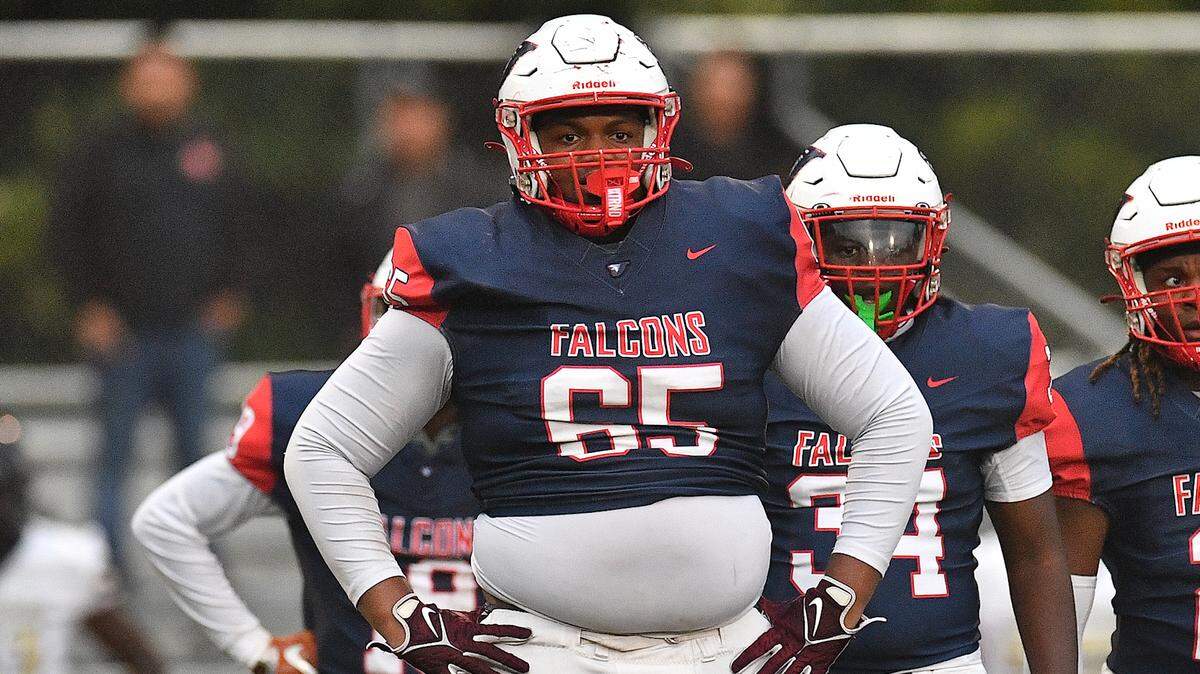 Noah Clark (65) looks to the sidelines between plays against Smithfield-Selma during the first half. The Durham Jordan Falcons and the Smithfield-Selma Spartans met in a football game in Durham, N.C. on September 13, 2024.