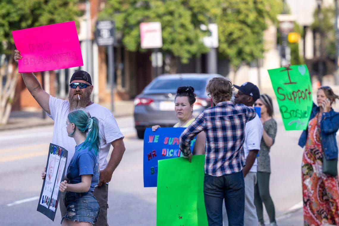 Some demonstrators show support for Johnston County Commissioner Richard “Dickie” Braswell prior to a Johnston County Board of Commissioners meeting at the Johnson County Courthouse in Smithfield on Monday, May, 1, 2023. Braswell, 74, was arrested last June after a 13-year-old girl told officers at the Johnston County Sheriff’s Office that she had an “inappropriate interaction with an adult male acquaintance.”