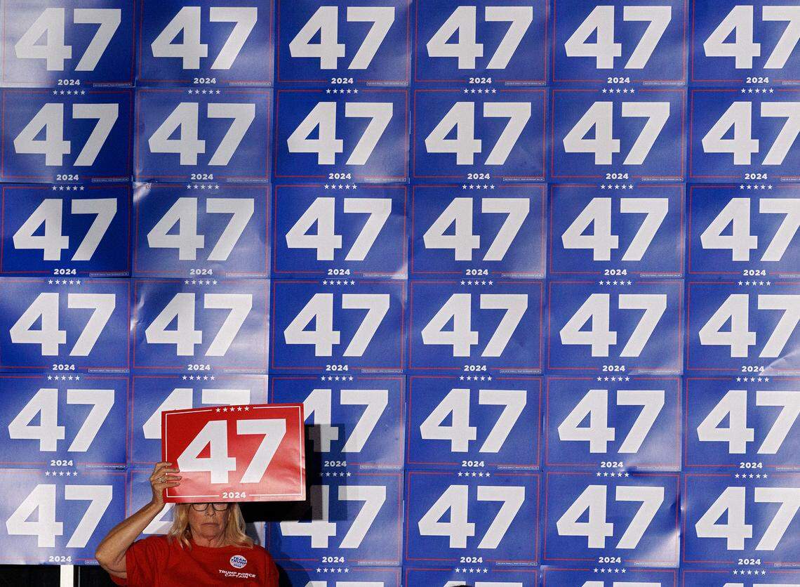 A person holds up a sign in support of former President Donald Trump during a rally at the Greensboro Coliseum Complex on Tuesday, Oct. 22, 2024, in Greensboro, N.C.