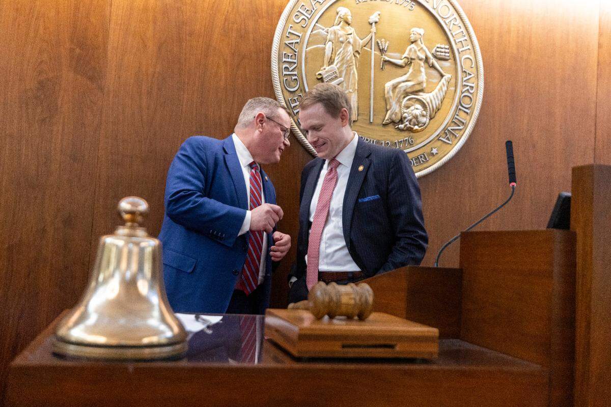 Former N.C. House speaker turned U.S. Rep. Tim Moore, left, congratulates newly elected Speaker Destin Hall on the first day of the North Carolina General Assembly’s 2025 legislative session Jan. 8, 2025, at the Legislative Building.