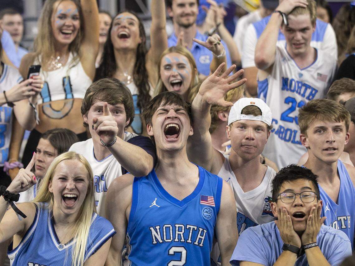 UNC student Cameron Burhans, center, of Winston-Salem, N.C., celebrates in the student section following the Tar Heels 81-77 victory over Duke in the NCAA Final Four semi-final on Saturday, April 2, 2022 at Caesars Superdome in New Orleans, La.