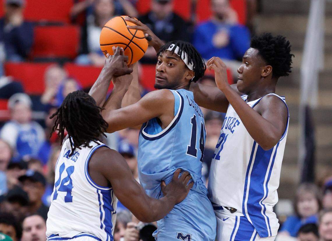 Duke’s Sion James (14) and Patrick Ngongba II (21) pressure Mount St. Mary’s Jedy Cordilia (14) during the first half of Duke’s game against Mount St. Mary’s in the first round of the 2025 NCAA Men’s Basketball Tournament at the Lenovo Center in Raleigh, N.C., Friday, March 21, 2025.