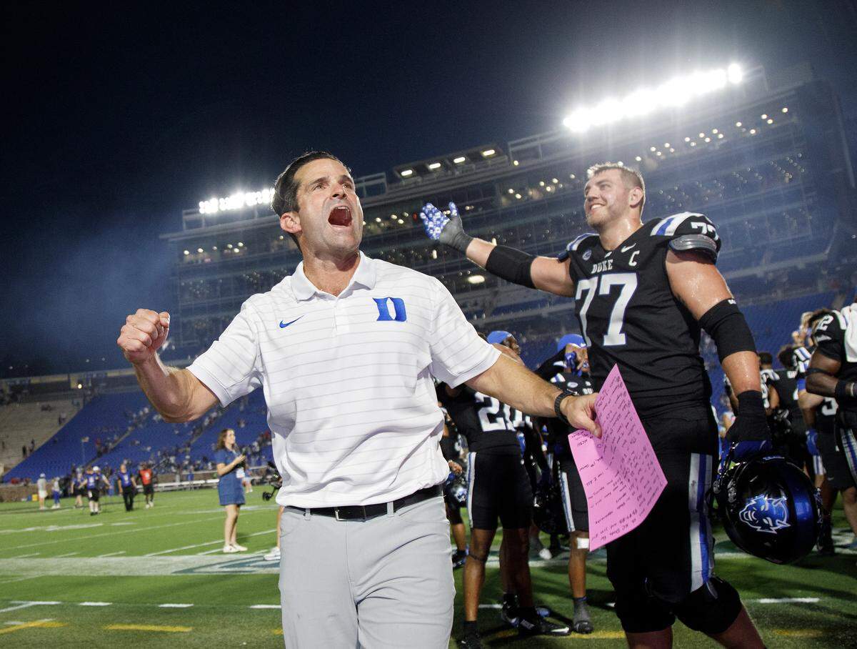 Duke head coach Manny Diaz celebrates following the Blue Devils’ 45-33 win over N.C. State on Saturday, Sept. 20, 2025, at Wallace Wade Stadium in Durham, N.C.