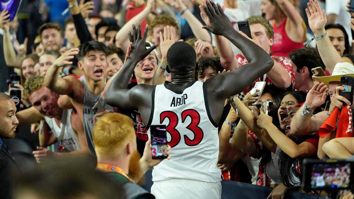 San Diego State Aztecs forward Aguek Arop (33) celebrates with fans after their win against the Florida Atlantic Owls in the semifinals of the Final Four of the 2023 NCAA Tournament at NRG Stadium.