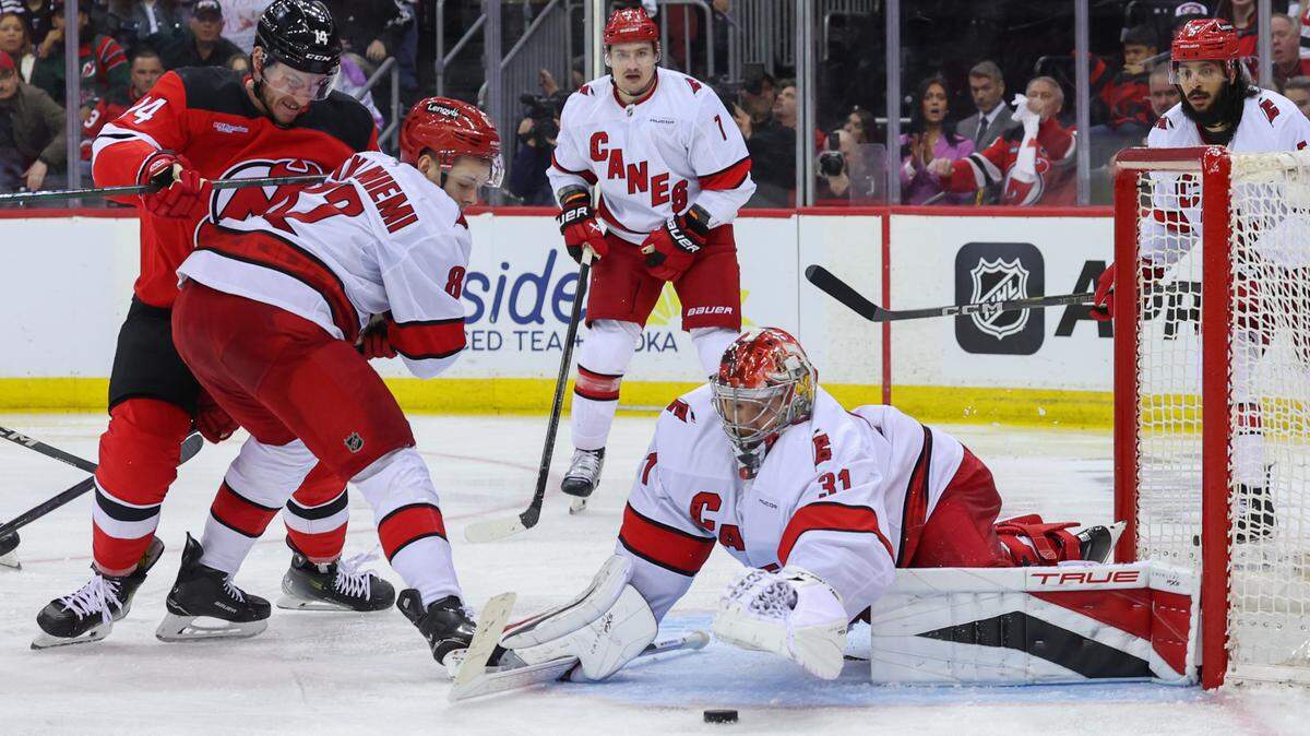 Carolina Hurricanes goaltender Frederik Andersen (31) makes a save against the New Jersey Devils during the first overtime in Game 3 of the first round of the 2025 Stanley Cup Playoffs at Prudential Center.