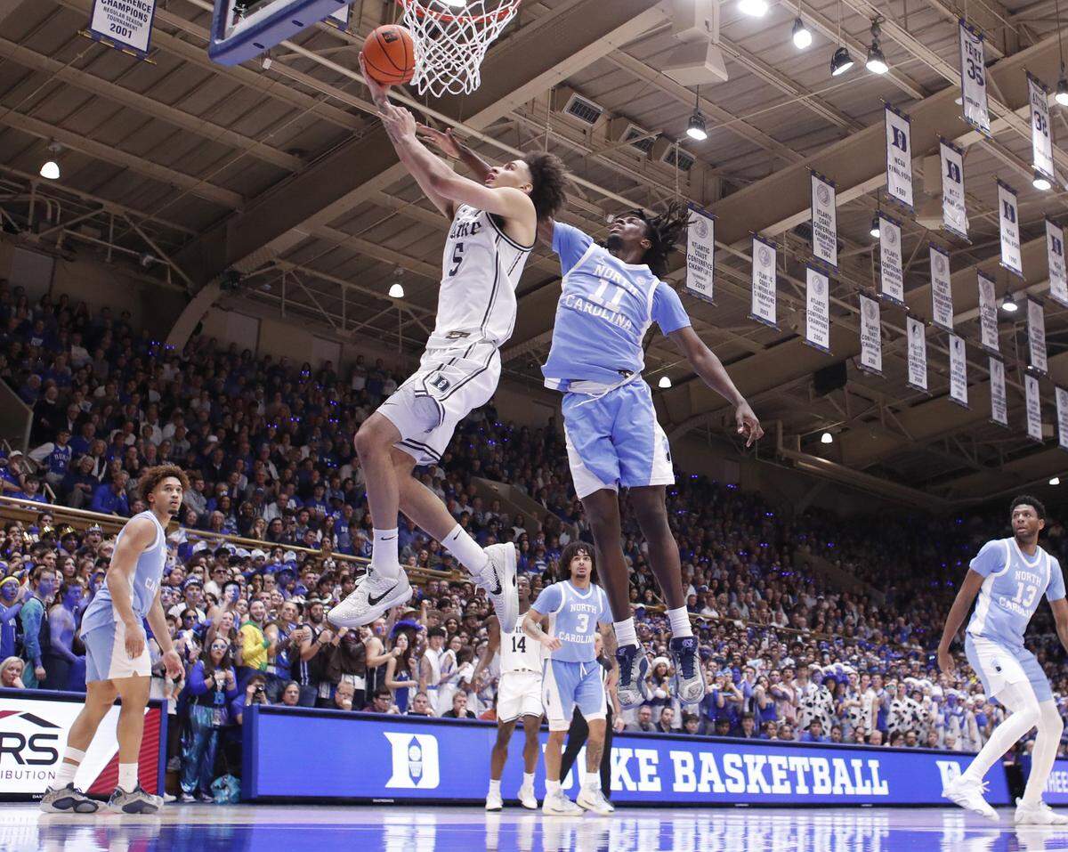 Duke’s Tyrese Proctor (5) drives to the basket past North Carolina's Ian Jackson (11) during Duke’s 87-70 victory over UNC at Cameron Indoor Stadium in Durham, N.C., Saturday, Feb. 1, 2025.