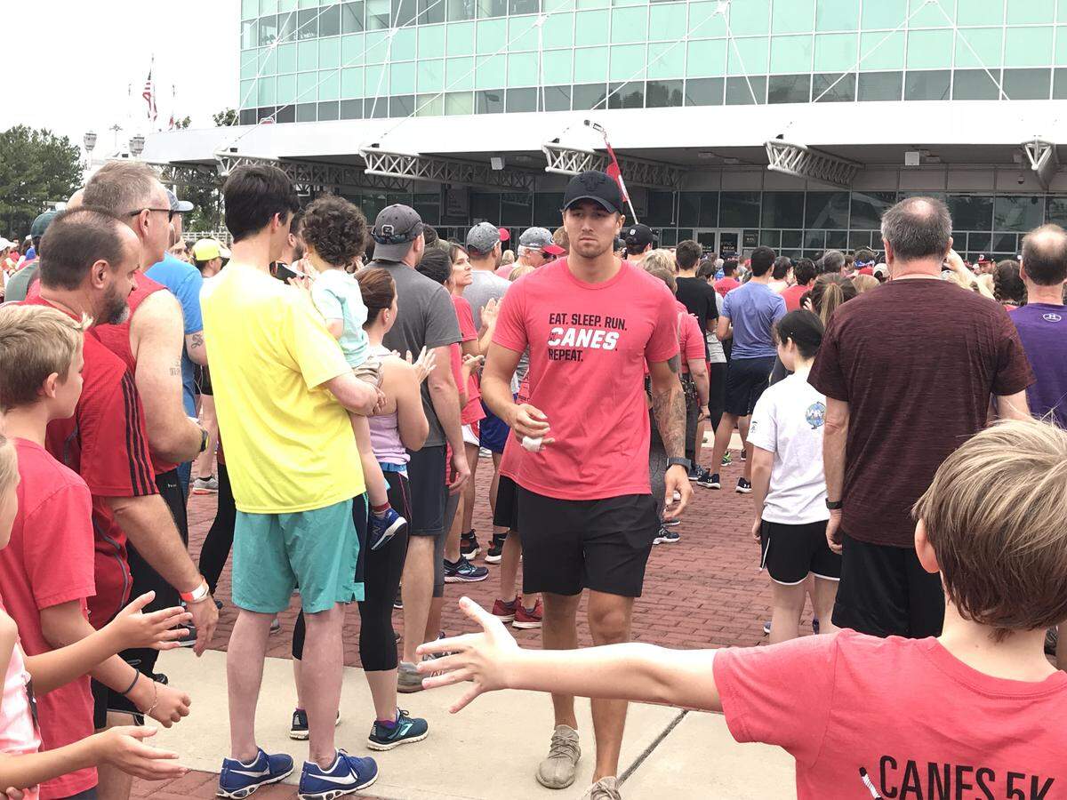 Carolina Hurricanes forward Victor Rask has last two fingers of right hand bandaged during player introductions before the Canes 5K run on Sept. 9, 2018 at PNC Arena. Rask had hand surgery Sept. 13.