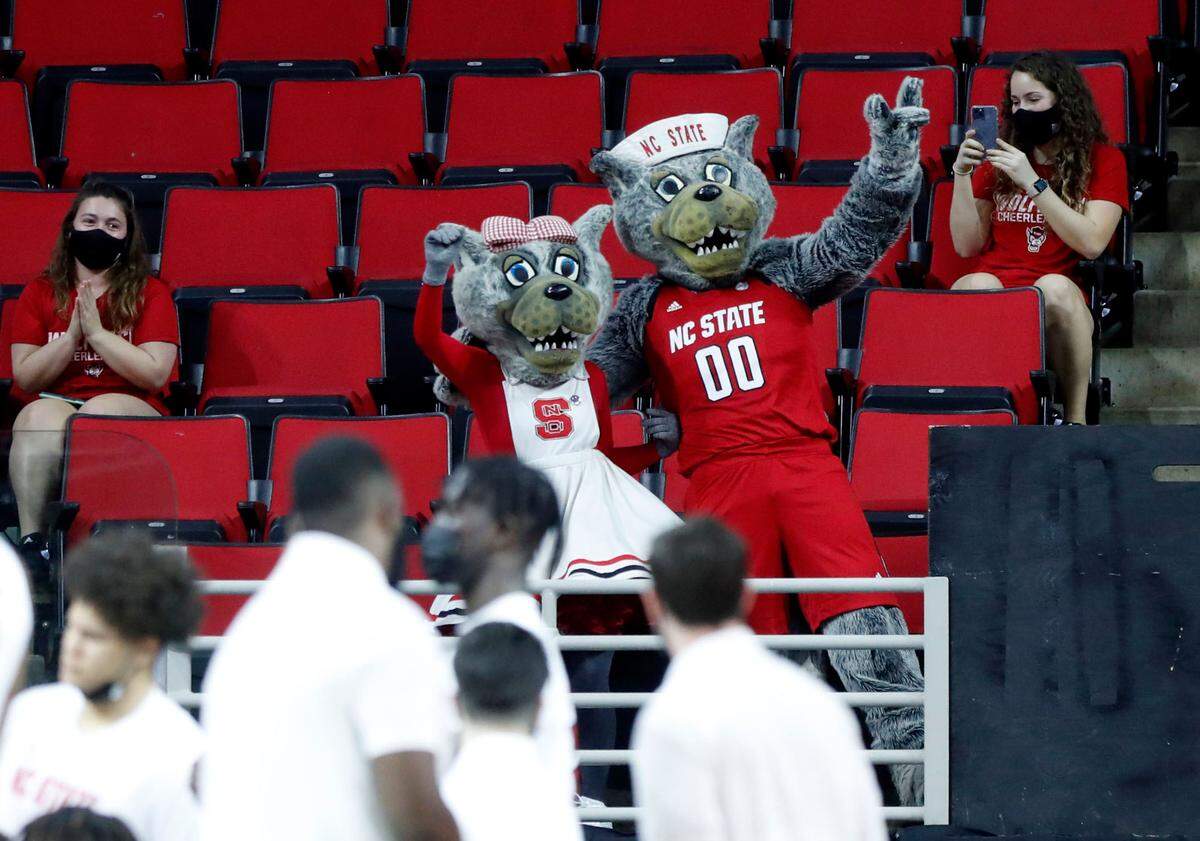 Mr. and Mrs. Wuf celebrate their 40th anniversary during the first half of N.C. State’s game against Pittsburgh at PNC Arena in Raleigh, N.C., Sunday, February 28, 2021.