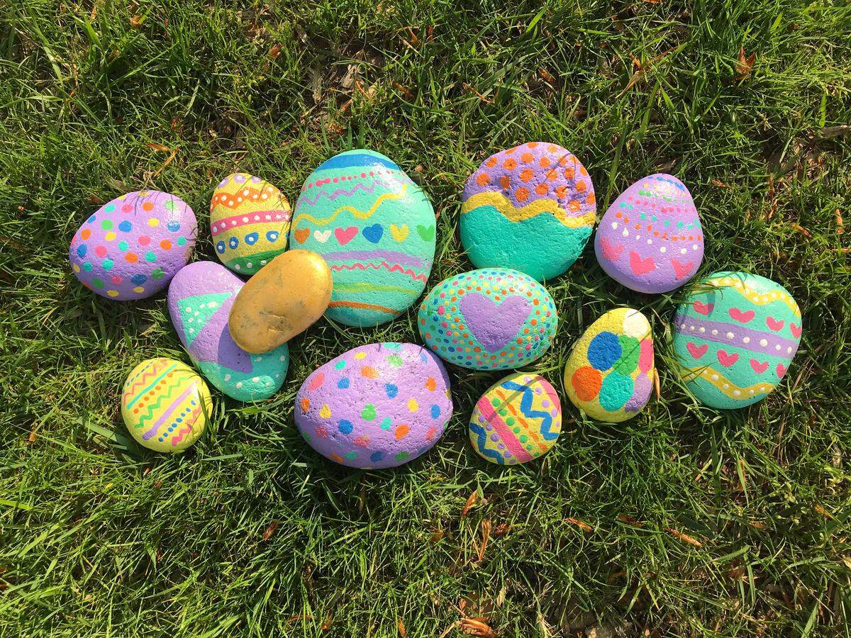 Mandy Becker and her daughter painted rocks to look like Easter eggs for families to search for in Fallon Park as annual Easter egg hunts have been canceled in Raleigh due to the coronavirus.