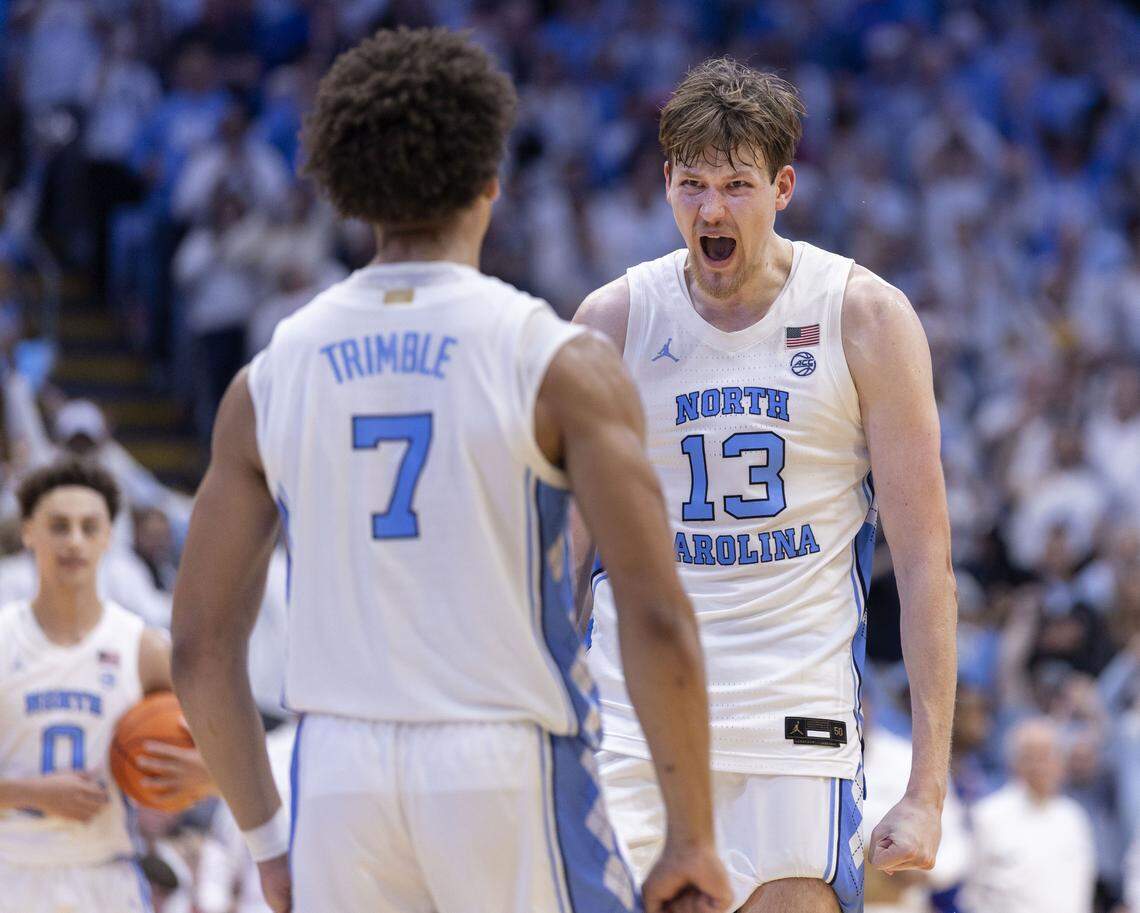 North Carolina center Henri Veesaar (13) and guard Seth Trimble (7) celebrate their 87-74 victory over Kansas on Friday, November 7, 2025 at the Smith Center in Chapel Hill, N.C.