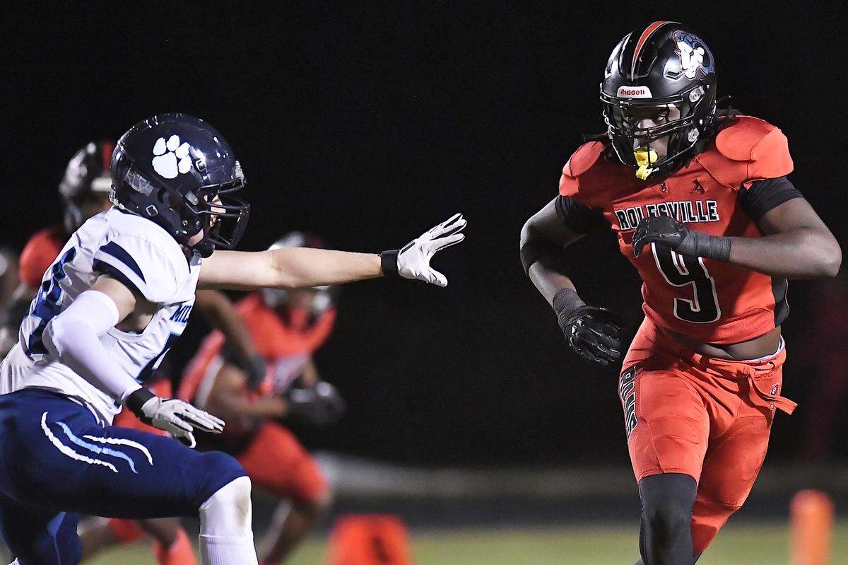 Rolesville defensive end Zavion Griffin-Haynes (9) moves against Millbrook’s Lane Ivy (54) during the first half. The Rolesville Rams and the Millbrook Wildcats met in a football game in Raleigh. N.C. on October 11, 2024.