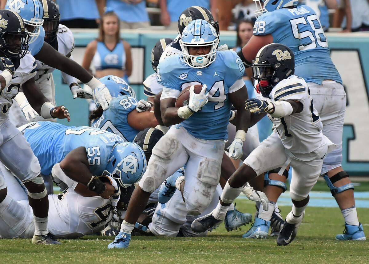 UNC running back Antonio Williams (24) breaks into the open during the fourth quarter against the Pitt defense. Williams 117 yards rushing and scored two touchdowns as UNC won their first game of the season 38-35 over Pittsburgh in Chapel Hill, N.C. Saturday, Sept.22, 2018.