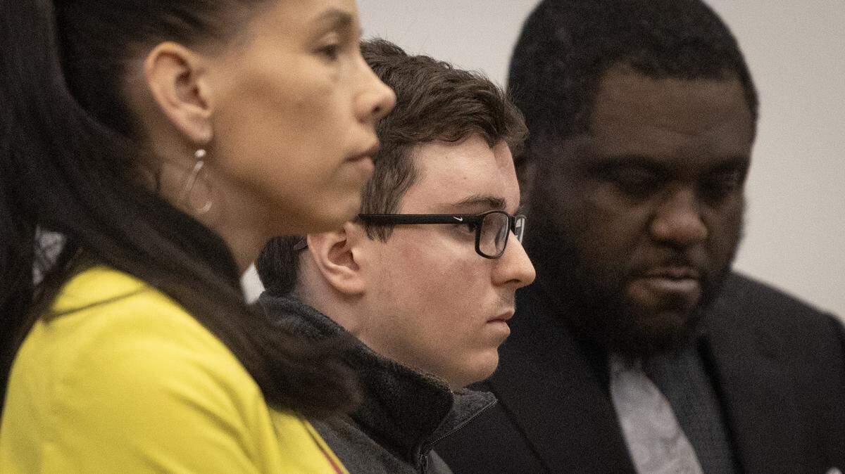 Austin Thompson, center, listens as Wake County Superior Court Judge Paul C. Ridgeway sentences him to five life sentences without the possibility of parole. on Friday.  Thompson confessed to killing five people in the east Raleigh neighborhood of Hedingham in 2022.