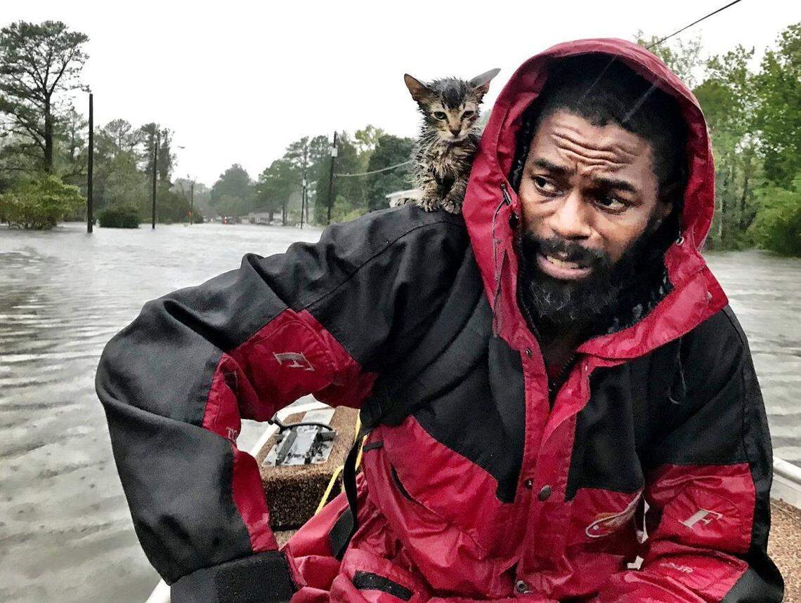 Robert Simmons Jr. and his kitten “Survivor” are rescued from floodwaters in New Bern, NC after Hurricane Florence dumped several inches of rain in the area overnight, Sept. 14, 2018. Hundreds were rescued from eastern North Carolina in the wake of the slow-moving storm.