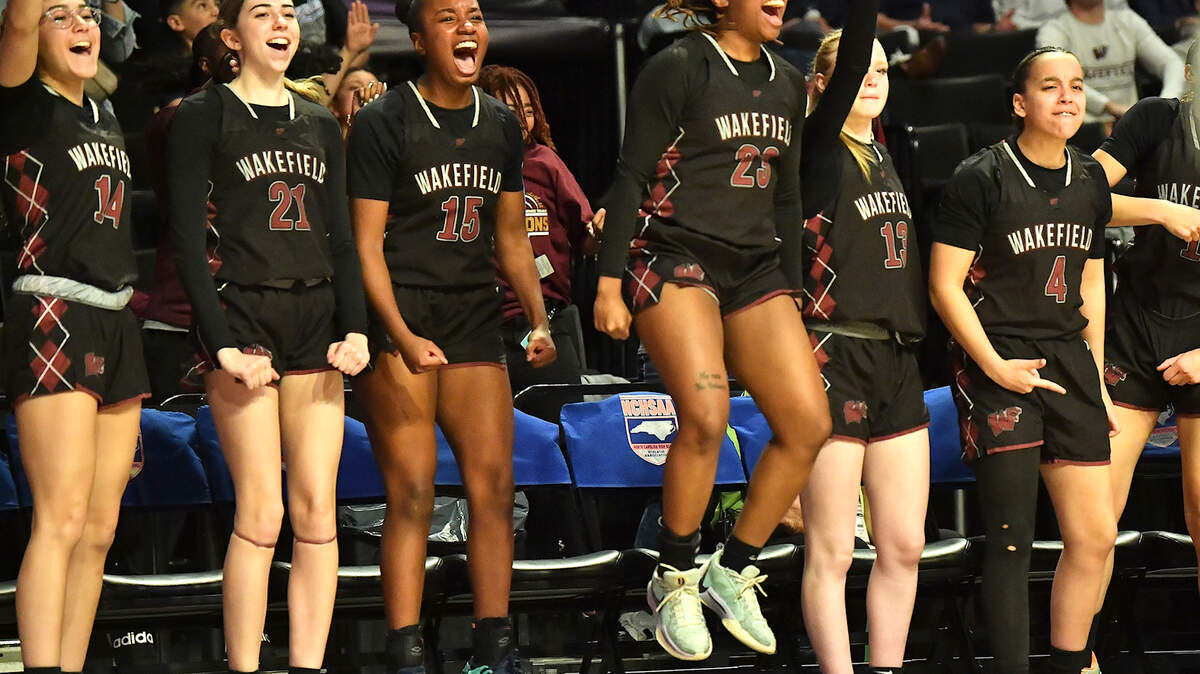 The Wakefield bench reacts to a call against Hoggard during the second half. The Wakefield Wolverines and the Hoggard Vikings met in the NCHSAA 4A East Regional Final in Winston-Salem, N.C. on March 12, 2025. Wakefield wins 31-23.