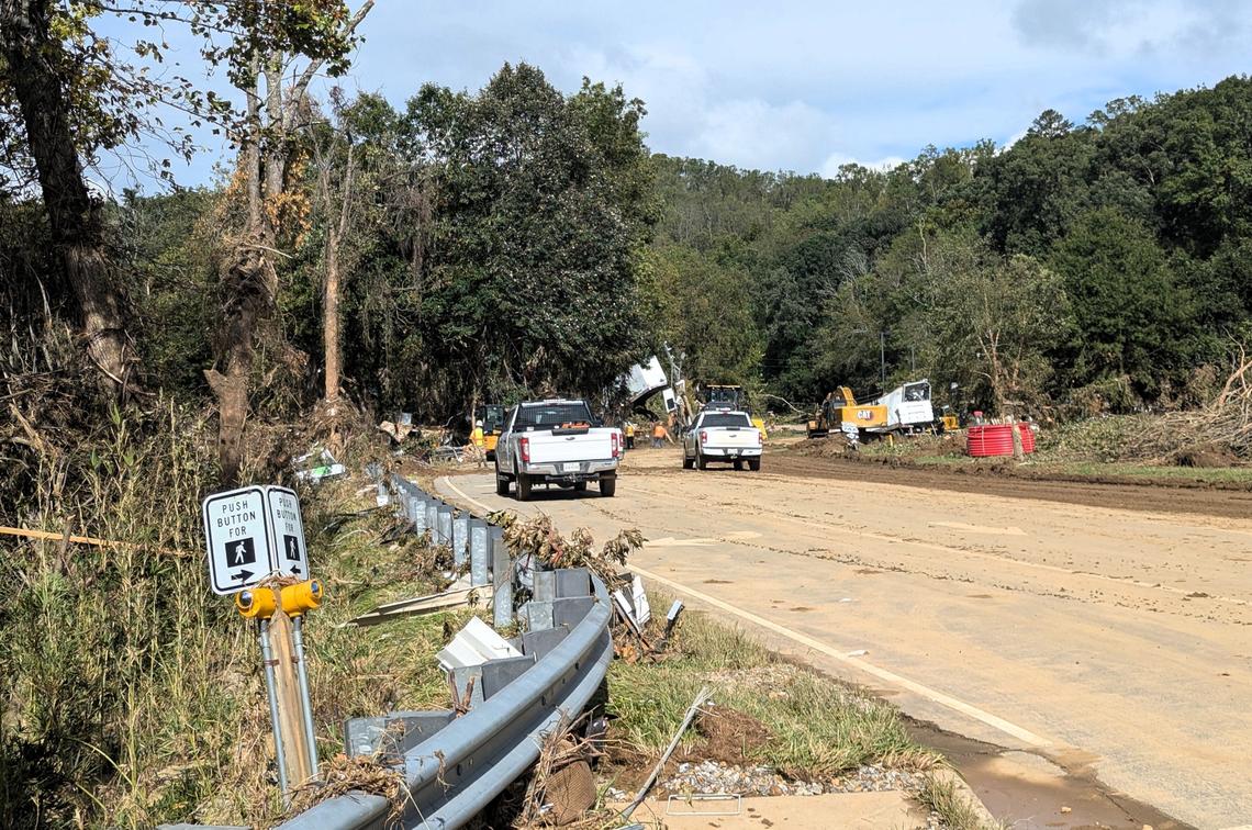 Emergency personnel and road crews were just beginning to clear this section of U.S. 74 Business through east Asheville this week. Chapel Hill police officers are helping Asheville police control traffic in areas where roads are unpassable.