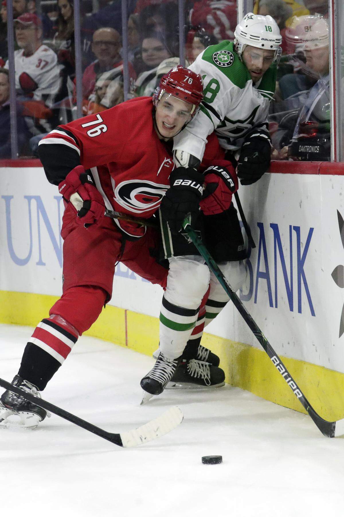 Carolina Hurricanes’ Brady Skjei (76) battles Dallas Stars’ Jason Dickinson (18) during the third period of an NHL hockey game against the Carolina Hurricanes in Raleigh, N.C., on Tuesday, Feb. 25, 2020. (AP Photo/Chris Seward)